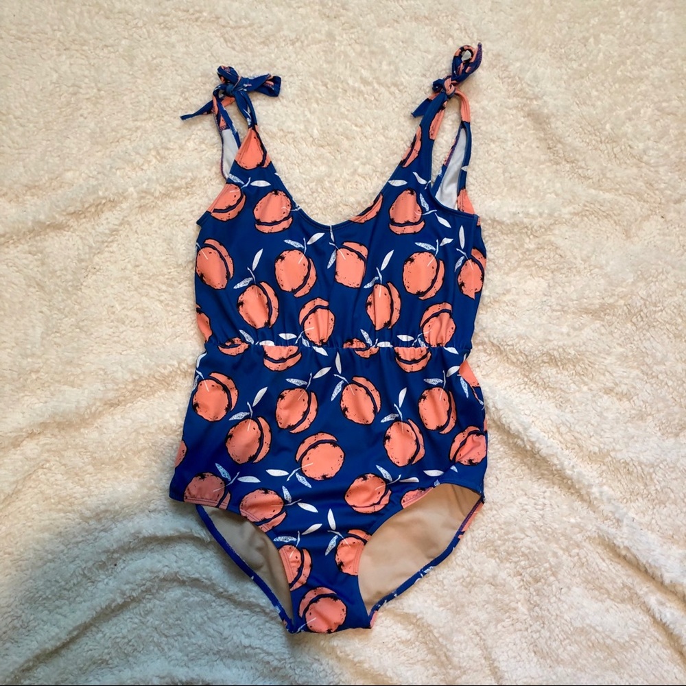 Kortni Jeane one-piece peach swimsuit